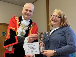 Annual Award winner Jane Mackenzie receives Fran Thomas Cup for highest points in handicraft.