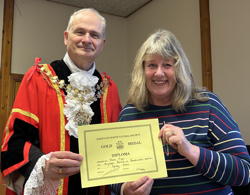 
Dawn Piper receives award for highest points in handicraft.